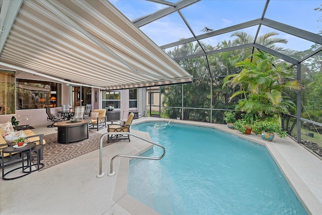 outdoor pool with an outdoor fire pit, a lanai, and a patio area