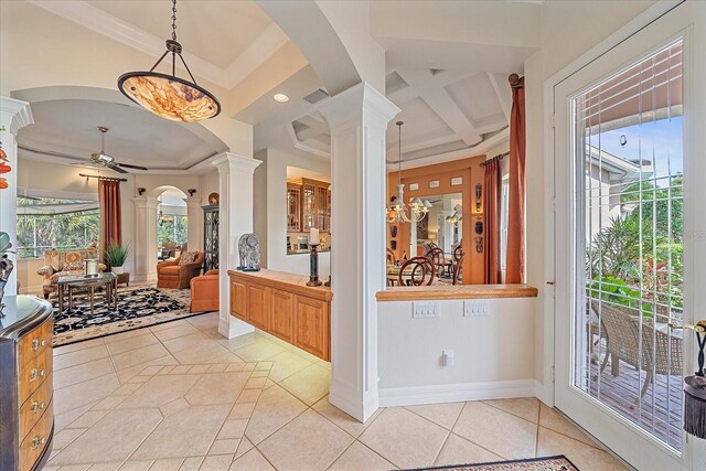 6617 Nautical Dr, Lakewood Ranch, FL 34202 - interior space with baseboards, coffered ceiling, arched walkways, ornate columns, and light tile patterned flooring