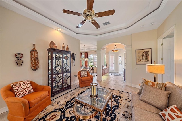 6617 Nautical Dr, Lakewood Ranch, FL 34202 - living room featuring arched walkways, a ceiling fan, visible vents, a raised ceiling, and ornate columns