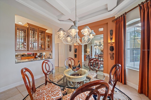 6617 Nautical Dr, Lakewood Ranch, FL 34202 - dining area featuring light tile patterned floors, baseboards, coffered ceiling, beamed ceiling, and an inviting chandelier