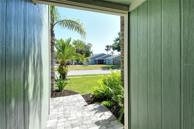 doorway to outside featuring brick floor