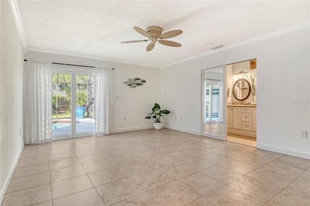 spare room with visible vents, ornamental molding, baseboards, a textured ceiling, and a ceiling fan