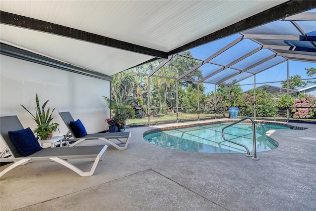 outdoor pool featuring a lanai and a patio