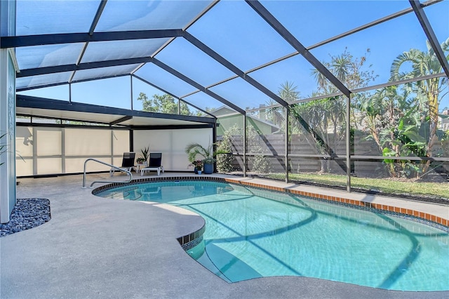outdoor pool with a patio area and a lanai