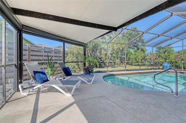 outdoor pool featuring a patio area and a lanai