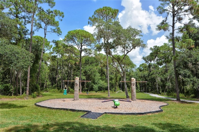 community jungle gym with a yard