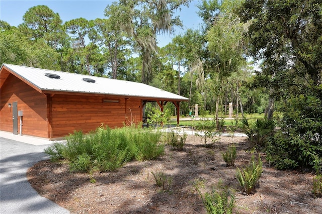 view of home's exterior with metal roof