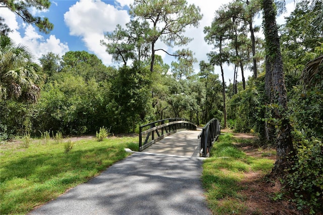 surrounding community featuring a wooded view