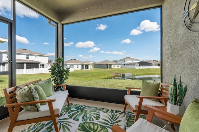 sunroom / solarium with a residential view