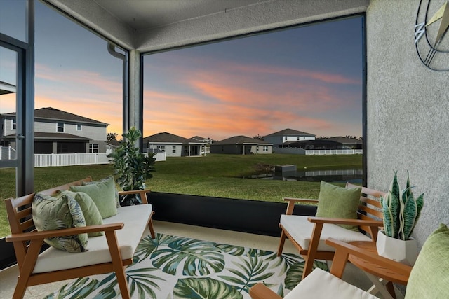 sunroom / solarium with a residential view