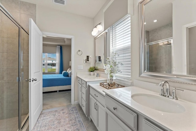 ensuite bathroom with visible vents, a stall shower, vanity, ensuite bath, and tile patterned flooring