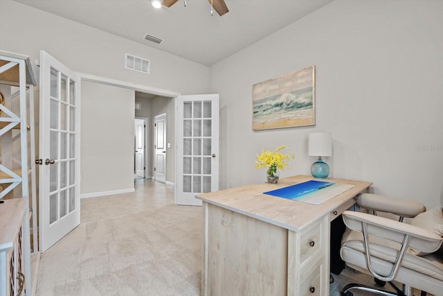 office featuring ceiling fan, french doors, visible vents, and light colored carpet