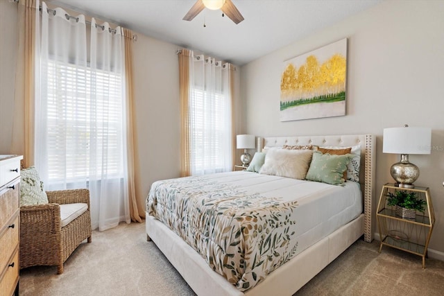 bedroom with lofted ceiling, carpet flooring, and multiple windows