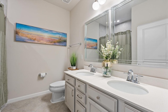 full bathroom featuring a shower with curtain, a sink, toilet, and tile patterned floors