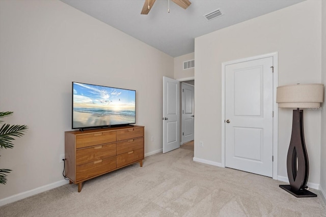 bedroom featuring visible vents, light carpet, and baseboards