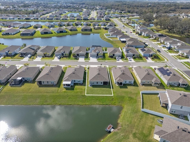 bird's eye view with a water view and a residential view