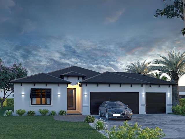 view of front of home featuring a garage, driveway, a shingled roof, a lawn, and stucco siding