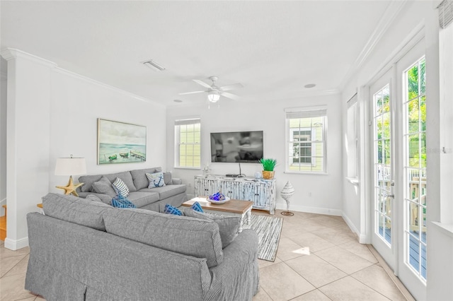 living area with ornamental molding, visible vents, baseboards, and light tile patterned floors