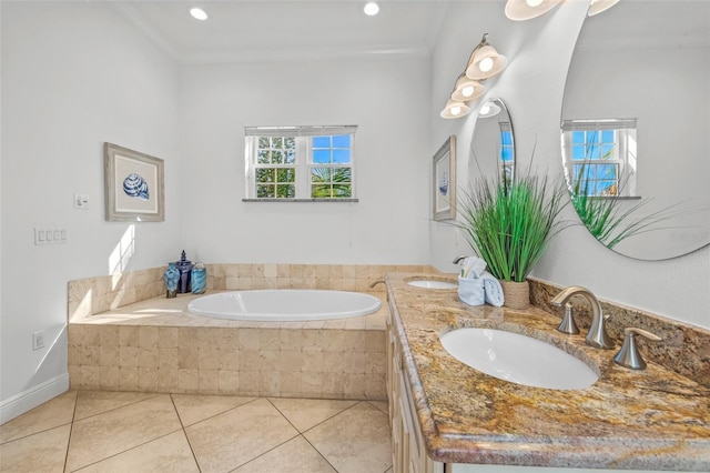 bathroom featuring tile patterned flooring, a sink, a bath, and crown molding