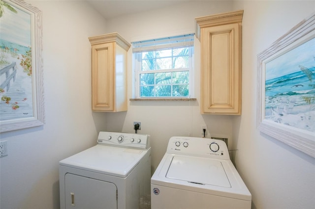 laundry room featuring cabinet space and independent washer and dryer