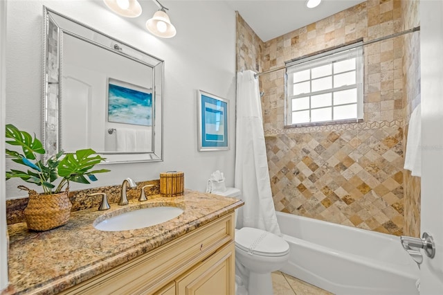 bathroom featuring toilet, tile patterned floors, vanity, and shower / tub combo with curtain