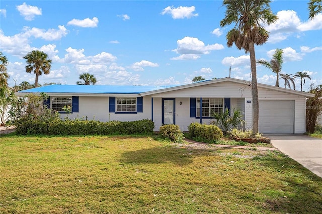 ranch-style house with a front lawn, concrete driveway, and an attached garage