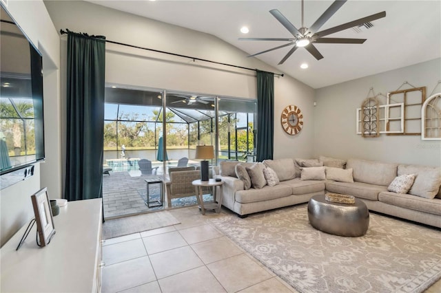 living room featuring ceiling fan, lofted ceiling, tile patterned flooring, visible vents, and a sunroom