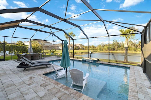 pool with a lanai, a patio area, and a water view