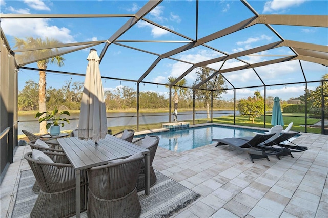 outdoor pool featuring a patio, a water view, and a lanai