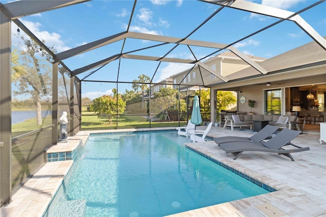 outdoor pool with a patio area and glass enclosure