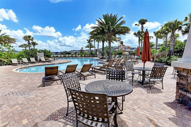 community pool with a patio area