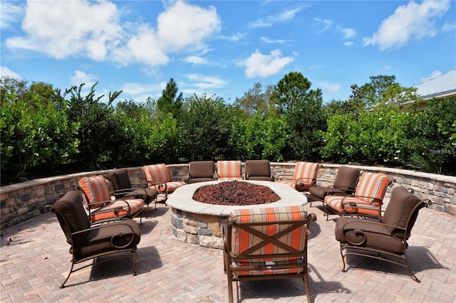 view of patio / terrace with an outdoor living space with a fire pit