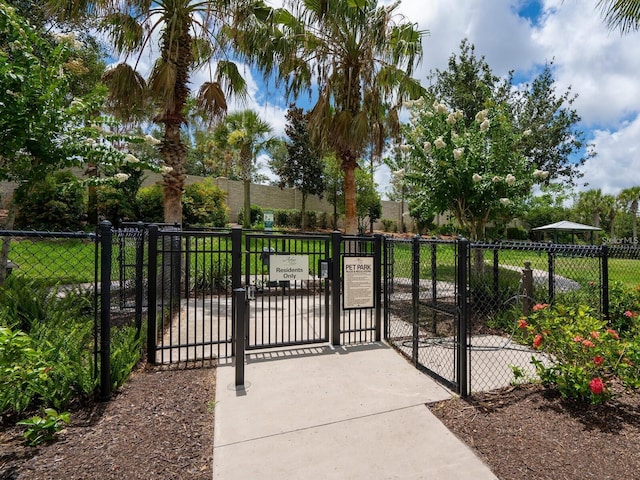 view of gate featuring fence