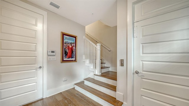 512 Laurel Park Dr, Sarasota, FL 34236 - staircase with baseboards, visible vents, and wood finished floors