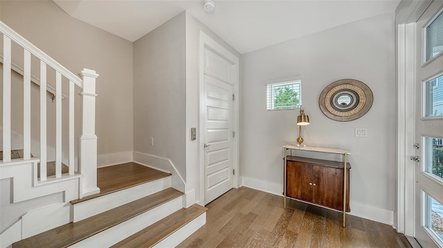 512 Laurel Park Dr, Sarasota, FL 34236 - entryway featuring stairway, wood finished floors, and baseboards
