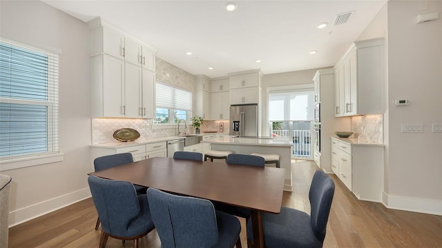 512 Laurel Park Dr, Sarasota, FL 34236 - dining area featuring recessed lighting, wood finished floors, visible vents, and baseboards