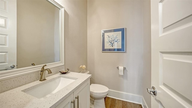 512 Laurel Park Dr, Sarasota, FL 34236 - bathroom featuring baseboards, vanity, toilet, and wood finished floors