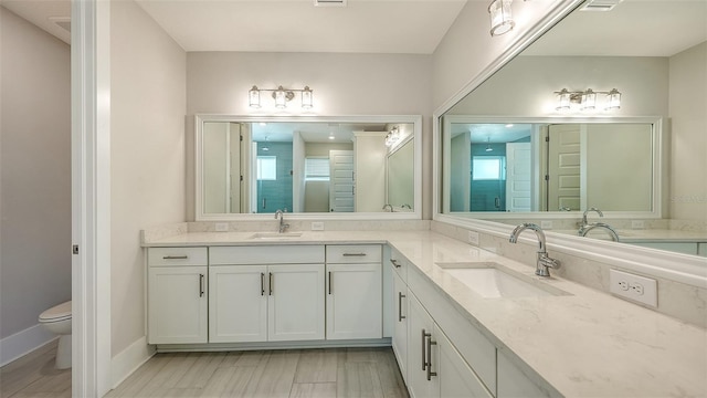 512 Laurel Park Dr, Sarasota, FL 34236 - full bath with baseboards, vanity, and toilet
