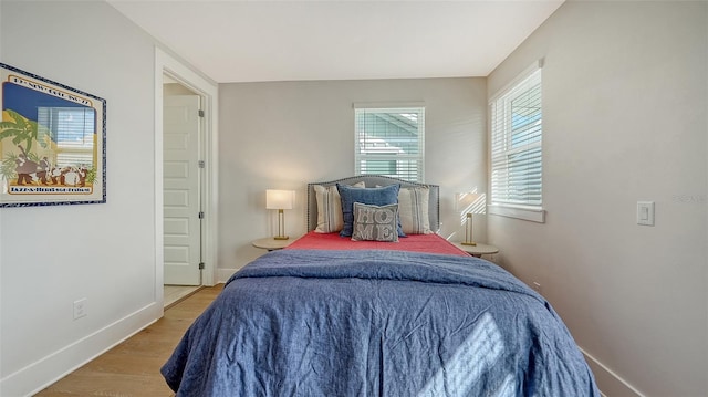 512 Laurel Park Dr, Sarasota, FL 34236 - bedroom featuring baseboards and wood finished floors