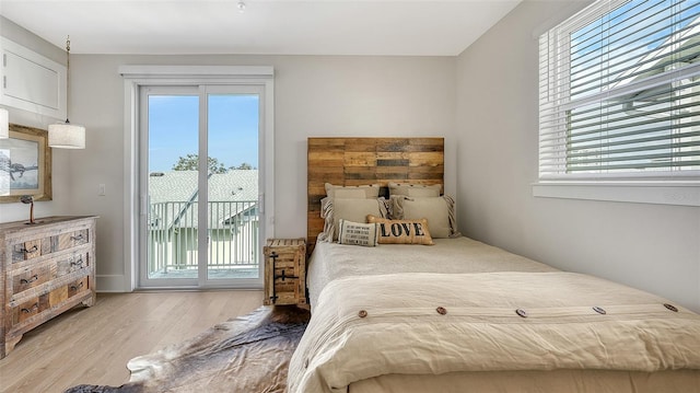 512 Laurel Park Dr, Sarasota, FL 34236 - bedroom featuring access to exterior and wood finished floors