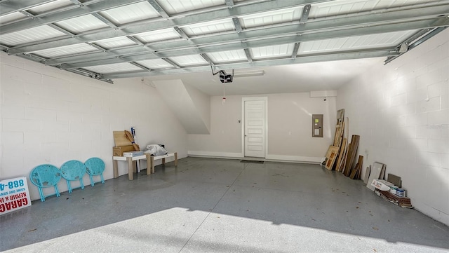512 Laurel Park Dr, Sarasota, FL 34236 - garage with concrete block wall, electric panel, and a garage door opener