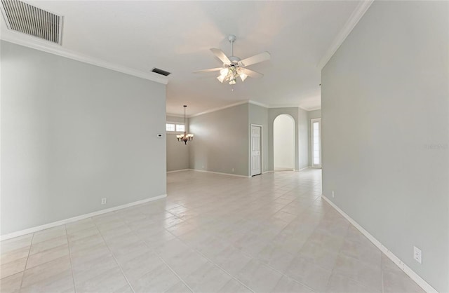 unfurnished room featuring ceiling fan with notable chandelier, baseboards, visible vents, and crown molding