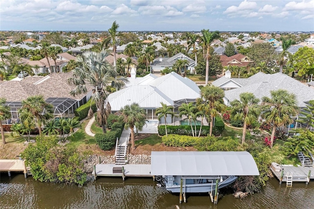 birds eye view of property featuring a residential view and a water view