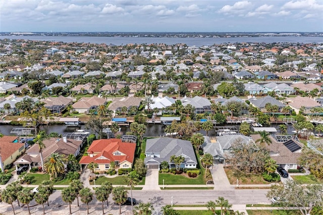 aerial view with a water view and a residential view