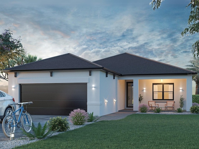 ranch-style home with a yard, a shingled roof, an attached garage, and stucco siding