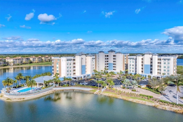 birds eye view of property with a water view