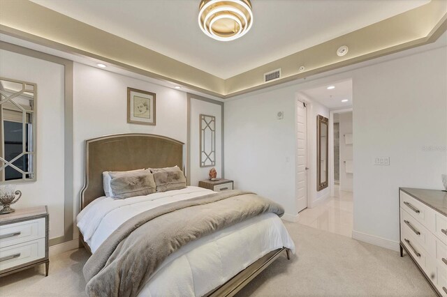 bedroom featuring recessed lighting, light colored carpet, visible vents, and baseboards