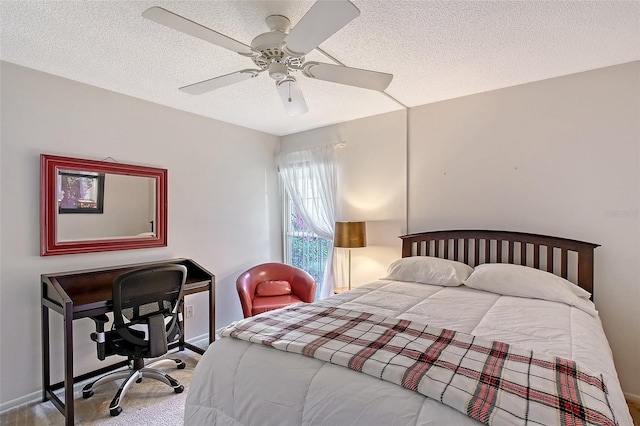 bedroom with a textured ceiling, carpet, a ceiling fan, and baseboards