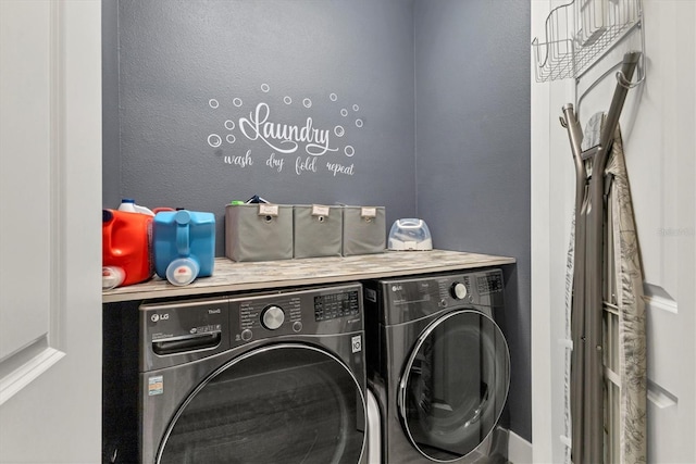 clothes washing area featuring laundry area and independent washer and dryer