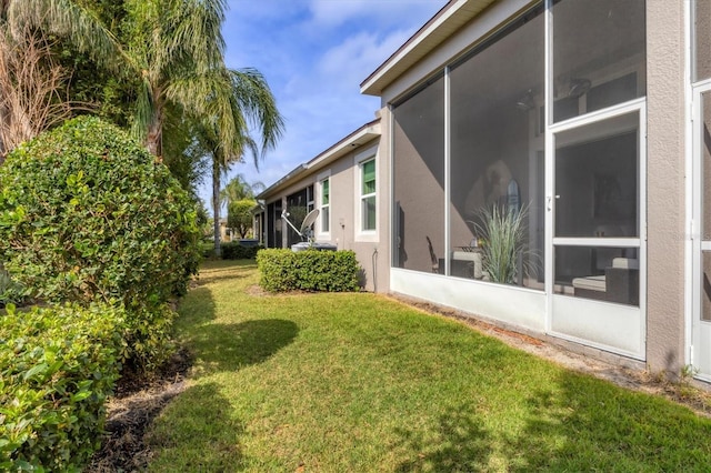 view of yard featuring a sunroom